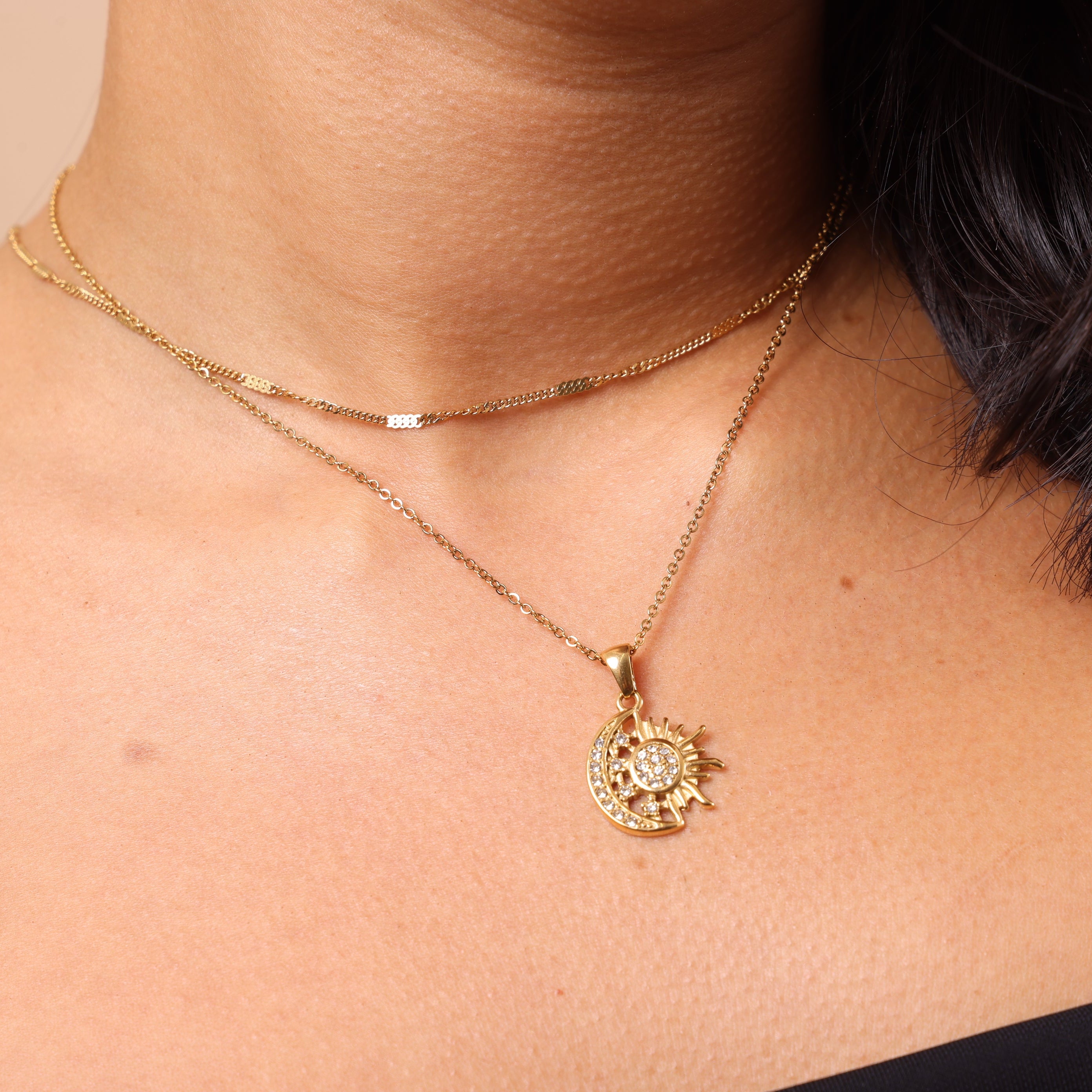 Model wearing Celestial Crystal Sun and Moon Pendant Necklace – delicate crystal pendant necklace, waterproof and anti-tarnish layering jewellery.