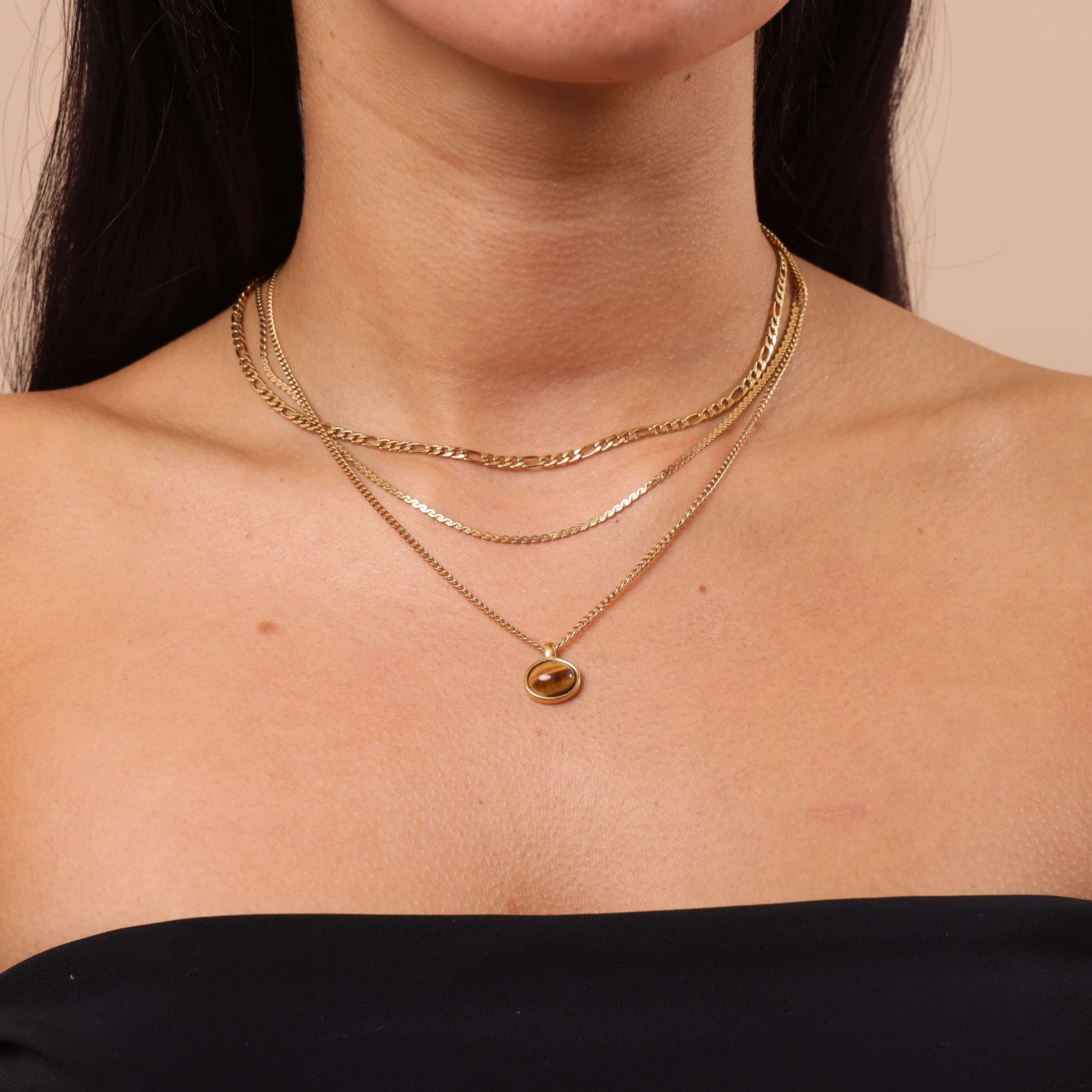 Tiger Eye Pendant Necklace layered with gold Figaro chain and thin snake chain β waterproof, anti-tarnish gold jewellery.