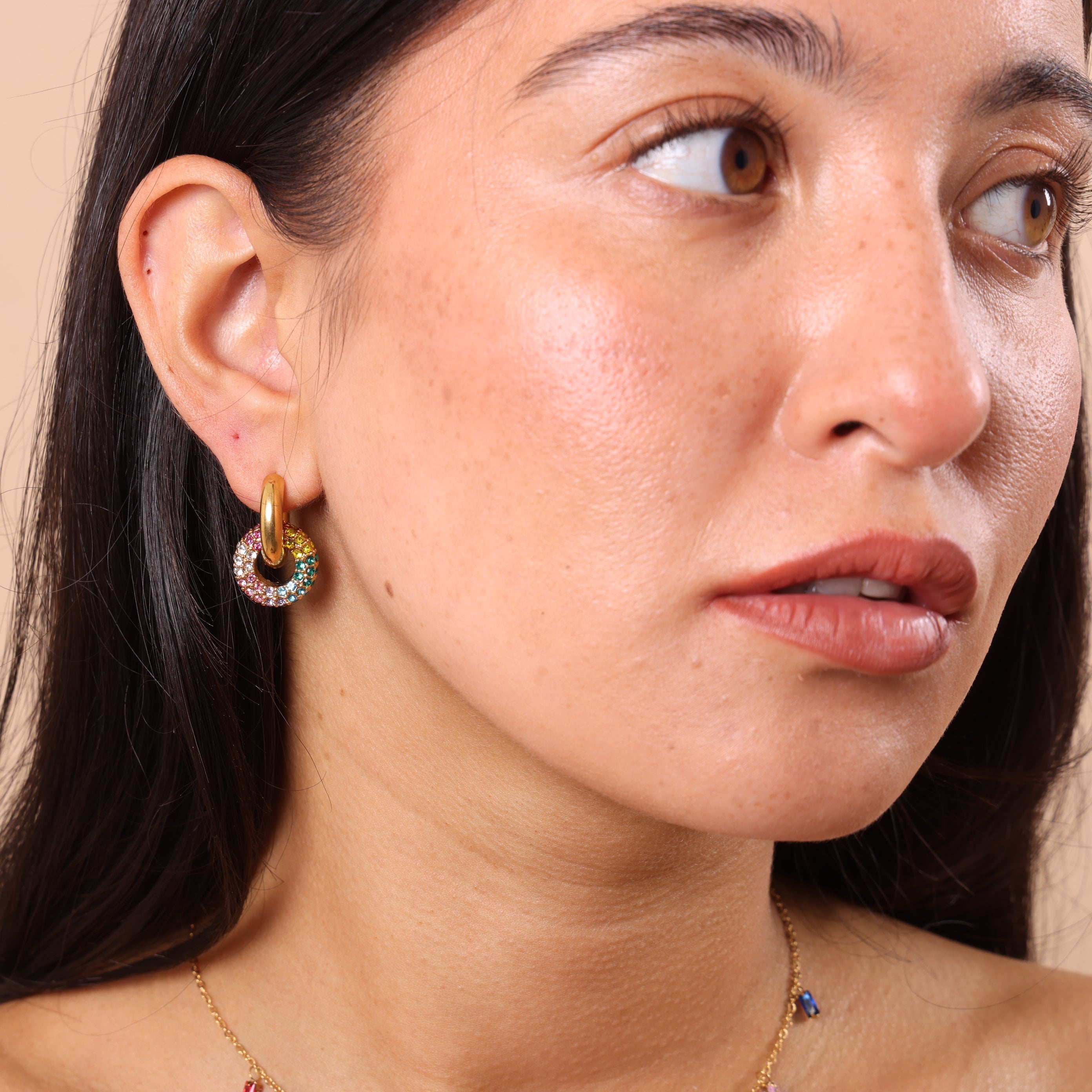 Model wearing chunky rainbow crystal charm hoop earrings – shiny, sparkly, waterproof, anti-tarnish jewellery