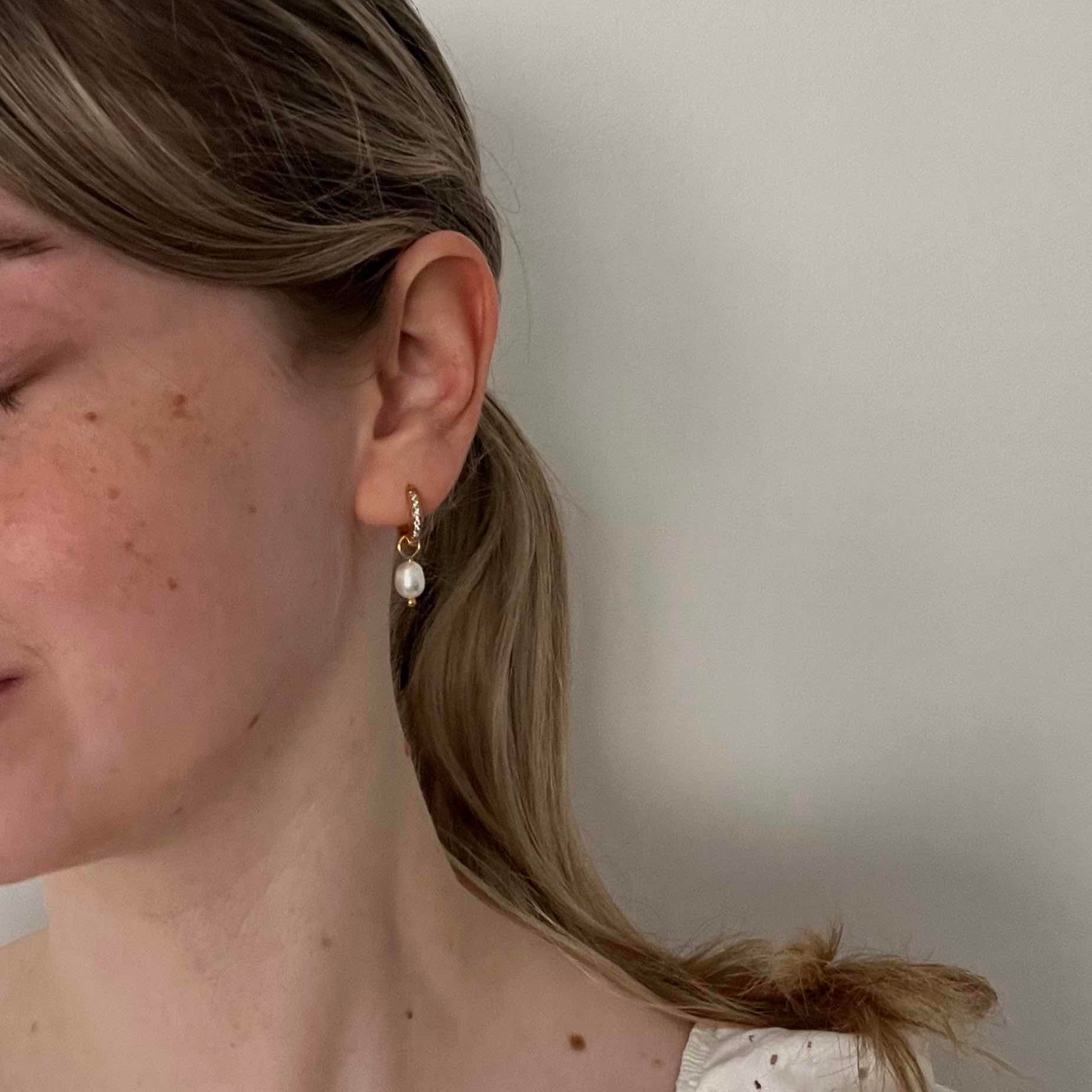 Crystal Pearl Charm Hoop Earrings with pearl charms styled on model – minimalist versatile jewellery, waterproof and anti-tarnish.