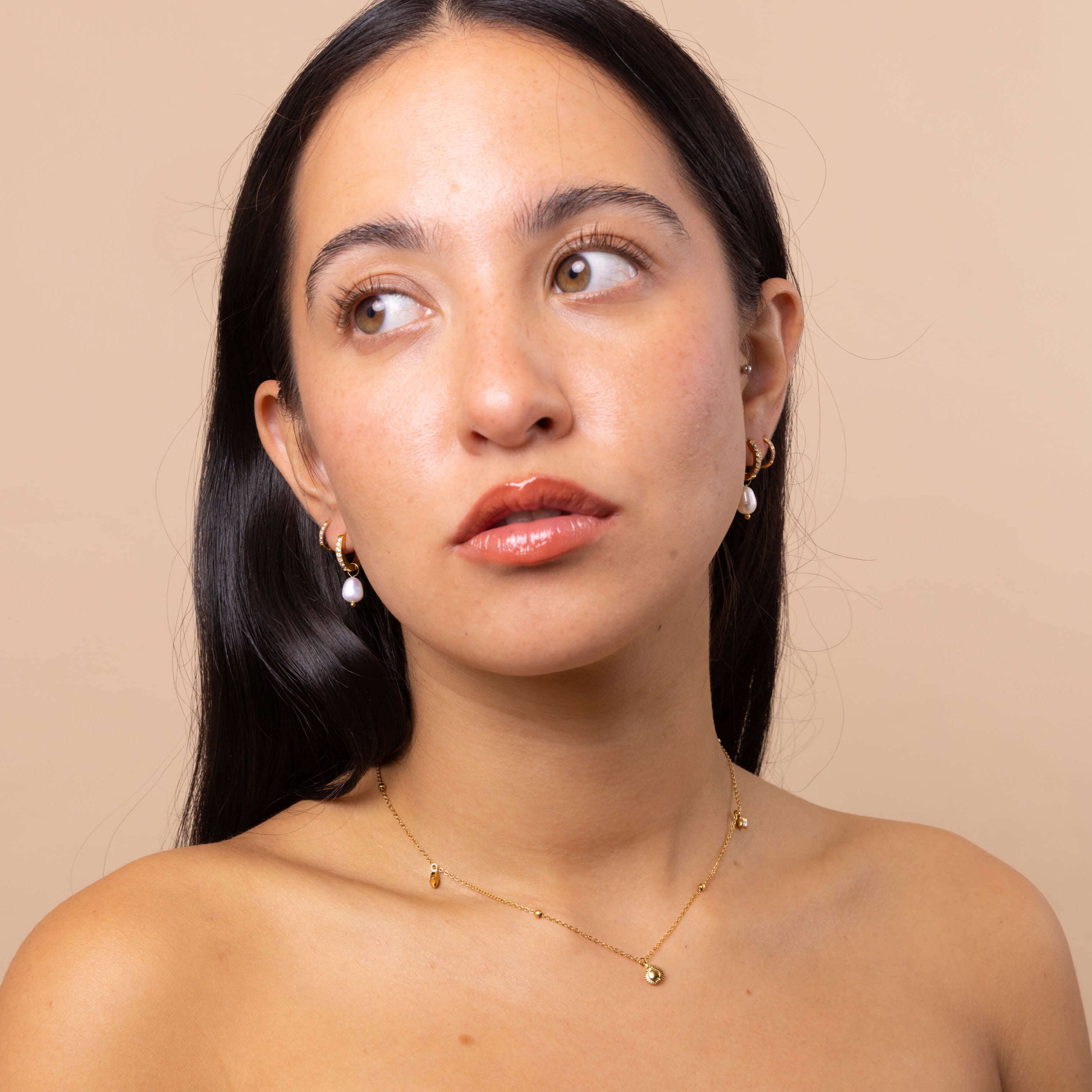 Model wearing stacked Crystal Pearl Charm Hoops – minimalist mini hoops with removable pearl charms, versatile waterproof anti-tarnish jewellery.