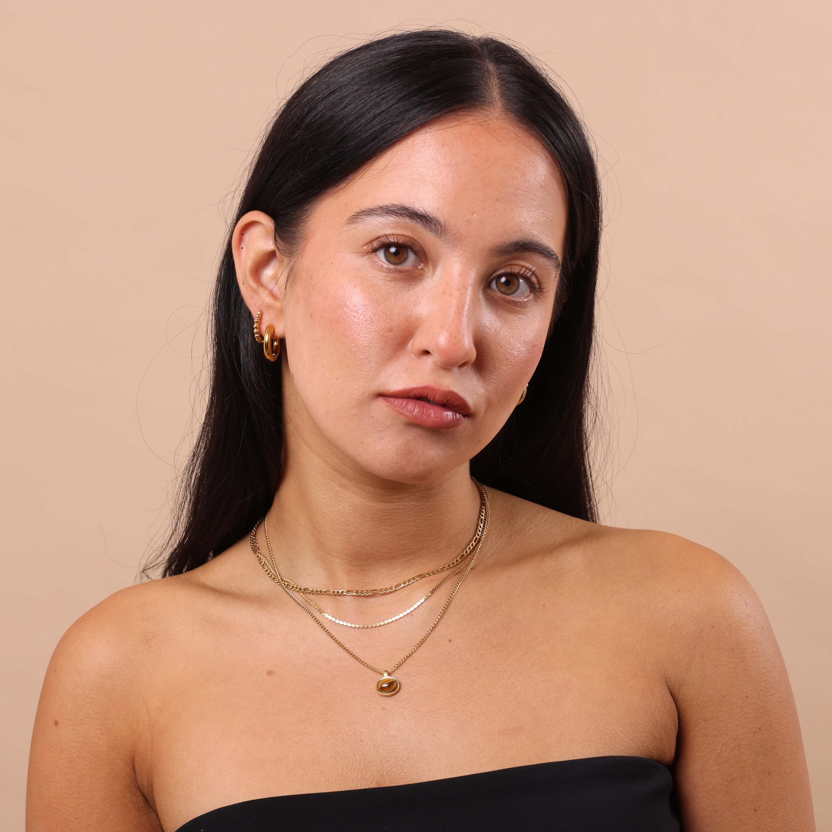 Dainty Gold Snake Chain Necklace layered with Figaro chain and Tiger Eye pendant necklace – waterproof anti-tarnish gold jewellery stack.