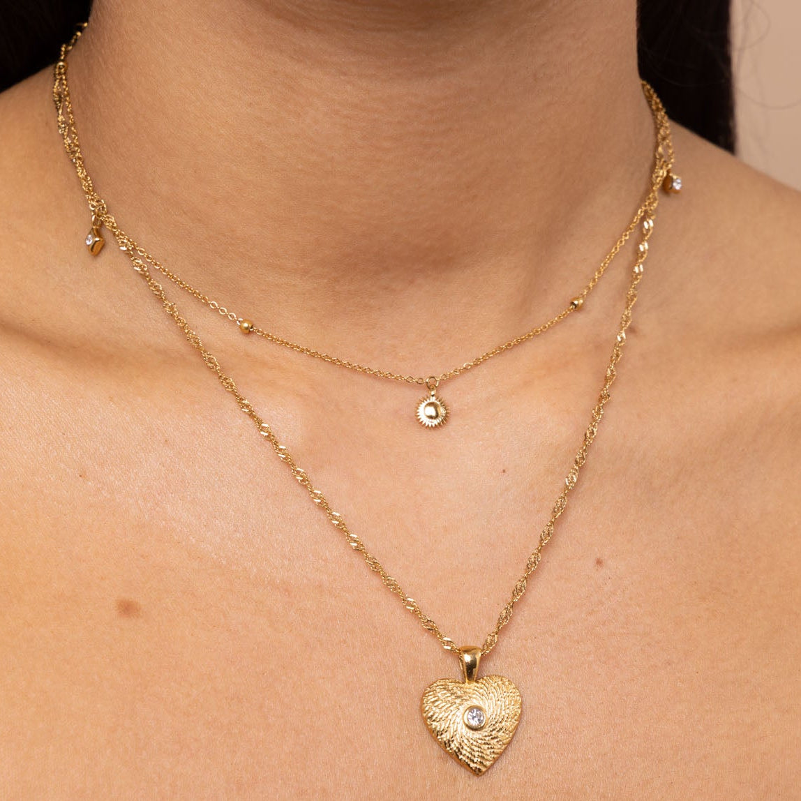 gold necklace layering