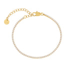Gold tennis bracelet with clear stones on a white background