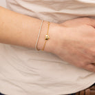 anti tarnish dainty tennis bracelet styled with dainty heart bracelet