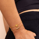 Gold Crystal Bar Chain Bracelet layered with dainty flower chain bracelet – waterproof anti-tarnish stacking jewellery.