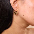 Close-up ear stack with Small Chunky Gold Open Hoop Earrings – layered gold hoops, waterproof anti-tarnish essential jewellery.
