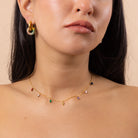 Close-up of model styling Rainbow Charm Necklace and rainbow crystal earrings – vibrant multi-coloured charms, waterproof anti-tarnish stainless steel jewellery.