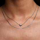 minimal heart pendant necklace in silver colour 