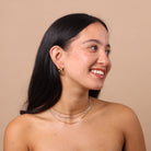 Mixed Metal Chunky Hoop Earrings styled with layered gold and silver chains – bestselling two-tone waterproof anti-tarnish hoops.