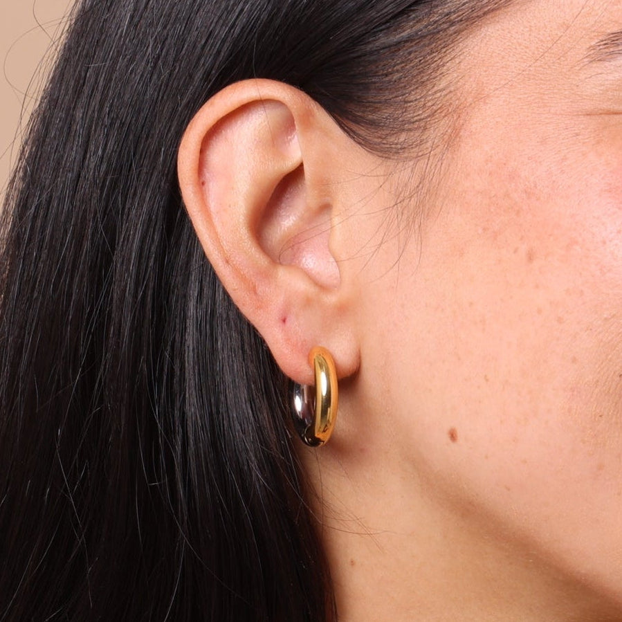 Mixed Metal Chunky Hoop Earrings styled with layered gold and silver chains – bestselling two-tone waterproof anti-tarnish hoops.