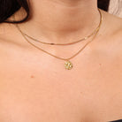 Small Round Textured Pendant Necklace layered with a thin chain – minimal dainty waterproof anti-tarnish jewellery for everyday wear.