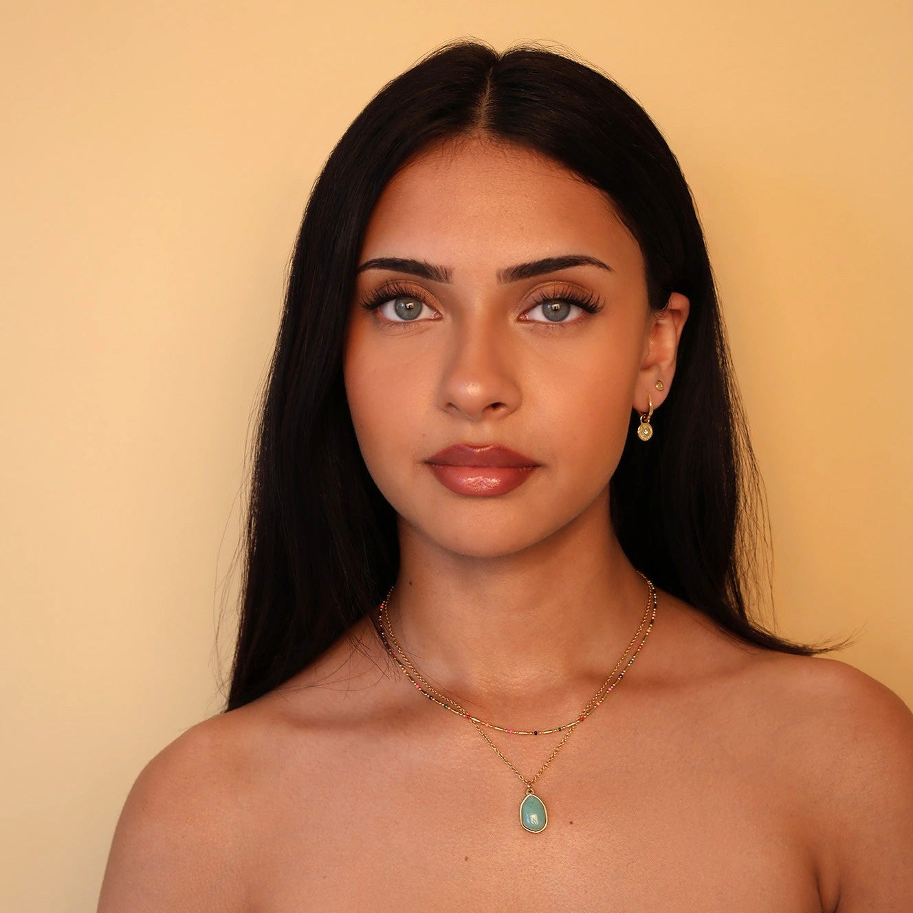 green jade pendant neckalce styled with colourful bead chain necklace 